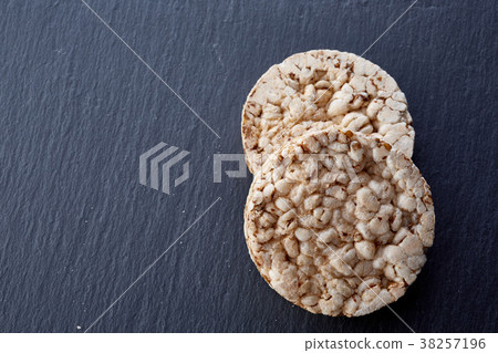 crispbread on stone plate. Dark stone background 38257196