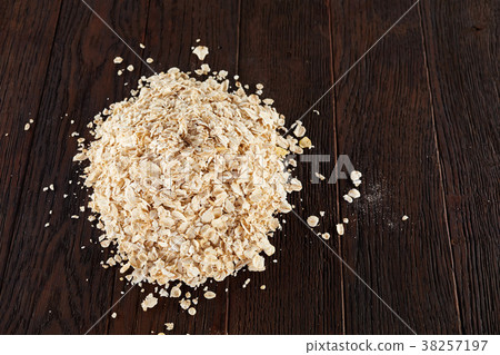 Healthy eating concept. Dry rolled oatmeal on 38257197