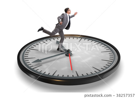 Businessman in time management concept Businessman in time management concept 38257357
