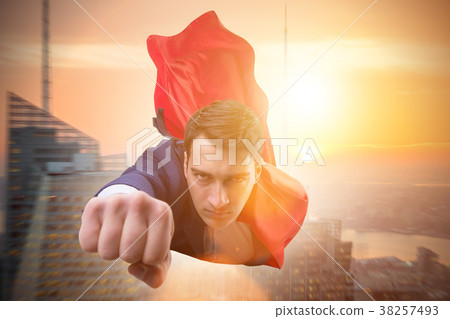 Flying super hero over the city  38257493