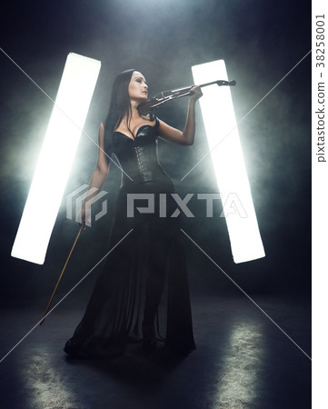 Violinist girl performs on stage. 38258001