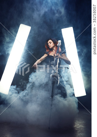 The cellist girl performs on stage. The cellist girl performs on stage. 38258007