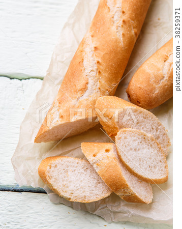 Hot french baguette at table 38259371