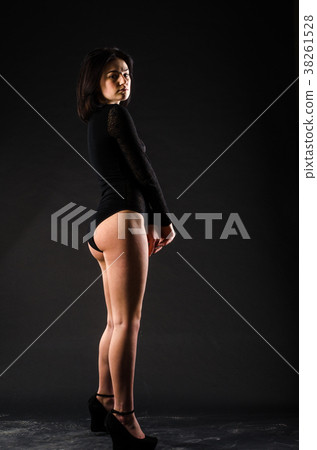 Young beautiful girl naked isolated on a black Young beautiful girl naked isolated on a black 38261528