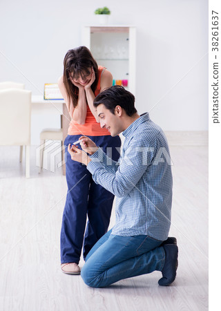 Wife and husband looking at pregnancy test Wife and husband looking at pregnancy test 38261637