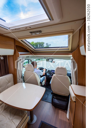 Man driving on a road in the Camper Van RV 38262030