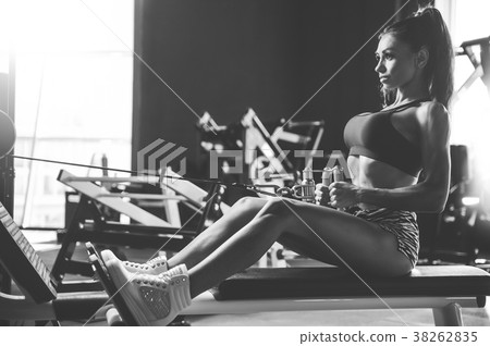 Sexy athletic young girl training back in gym Sexy athletic young girl training back in gym 38262835
