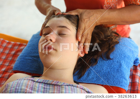 head face thai massage teenager girl with closed 38263613