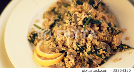 Vegetarian couscous with mushrooms and spinach. Vegetarian couscous with mushrooms and spinach. 38264330