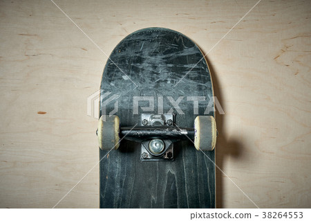top view of skateboard on wooden background 38264553