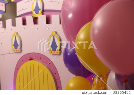 Heap of balloons on toy house background Heap of balloons on toy house background 38265495