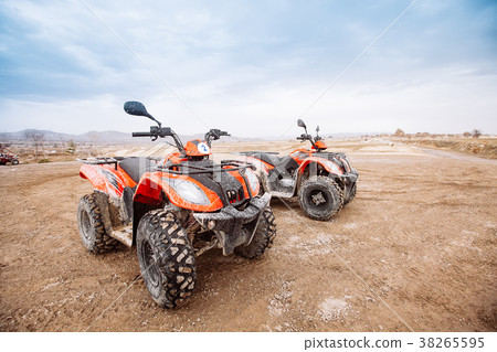 ATV Quad Bike in front of mountains landscape ATV Quad Bike in front of mountains landscape 38265595