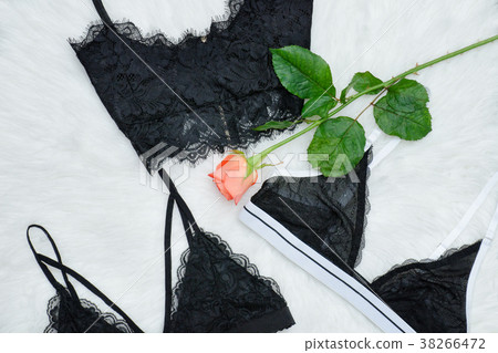 Fashion concept. Three lace bustier on a white fur Fashion concept. Three lace bustier on a white fur 38266472