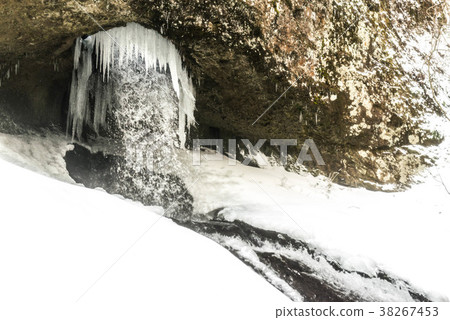 Snow scene of a waterfall 38267453