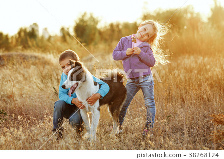 Family. Brother, sister and dog. 38268124