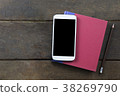 Empty screen mobile on red cover book and pencil  38269790