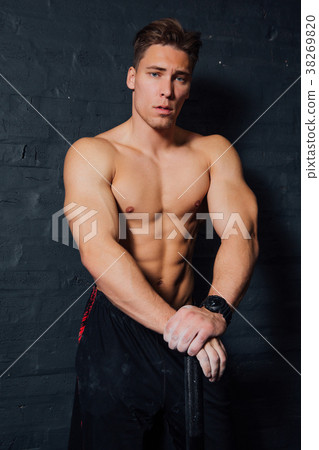 portrait of a young physically fit man workout at portrait of a young physically fit man workout at 38269820