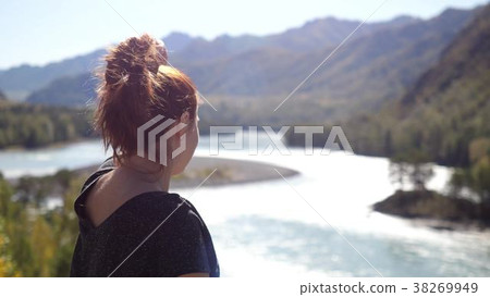 Young woman with red hair relaxation in the Young woman with red hair relaxation in the 38269949