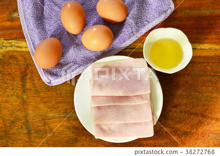 fresh ham pork on plate and egg with oil cup fresh ham pork on plate and egg with oil cup 38272768