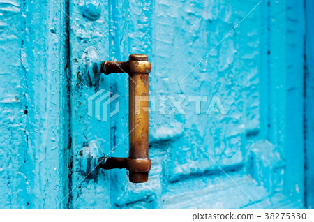 Close-up keyholes with curtains and a handle on 38275330