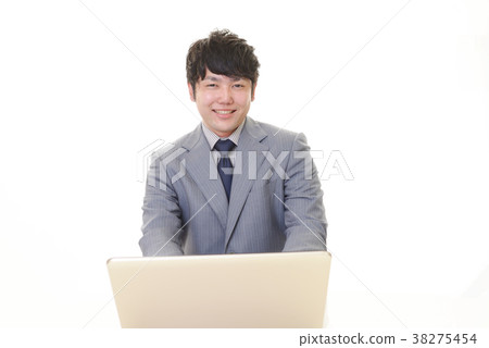 A businessman working on a laptop A businessman working on a laptop 38275454
