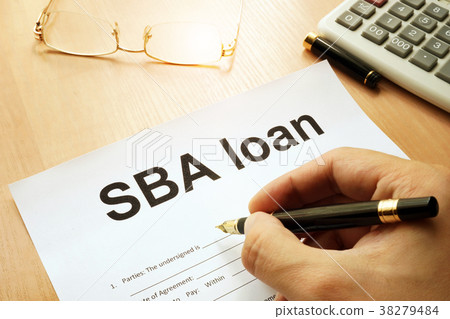 SBA loan form on a table. 38279484
