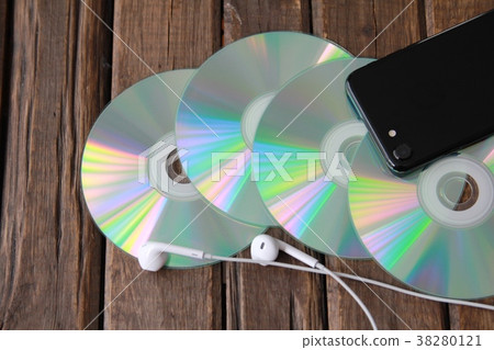 Wired earphones, CD and smartphone music image Wired earphones, CD and smartphone music image 38280121