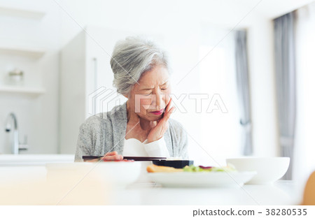 Senior woman eating food 38280535