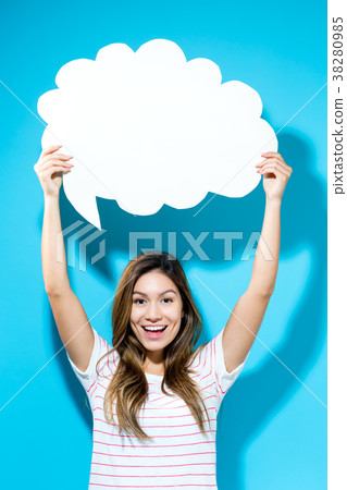 Young woman holding a speech bubble Young woman holding a speech bubble 38280985