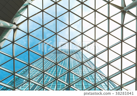Looking up at a skyscraper and the sky above 38281041
