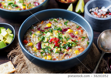 Vegetable quinoa soup stew with avocado corn beans 38281052