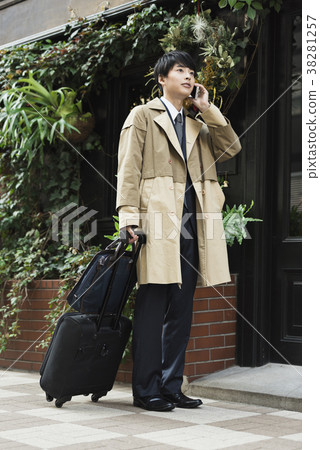 Businessman calling on overseas business trip 38281257