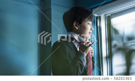 High school student tightening a tie High school student tightening a tie 38281363