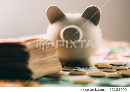 Piggy moneybox with euro cash 38283503