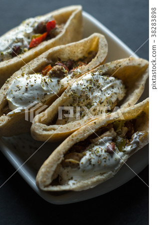 Tortilla stuffed with chicken and vegetables with Tortilla stuffed with chicken and vegetables with 38283898
