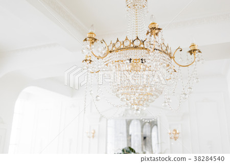 Expensive interior. Large electric chandelier made Expensive interior. Large electric chandelier made 38284540