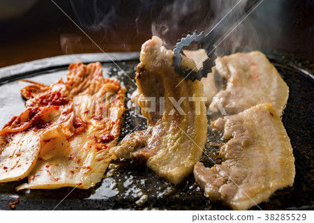 Korean BBQ Samgyeopsal: Pork belly grilled on a hot plate, served with gochujang and kimchi. Perfect for banquets and parties. Korean BBQ Samgyeopsal: Pork belly grilled on a hot plate, served with gochujang and kimchi. Perfect for banquets and parties. 38285529
