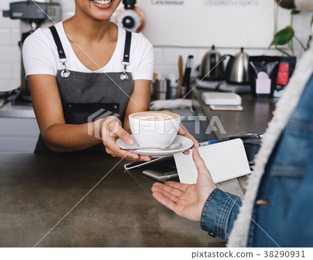Unrecognizable coffee shop owner with cup Unrecognizable coffee shop owner with cup 38290931