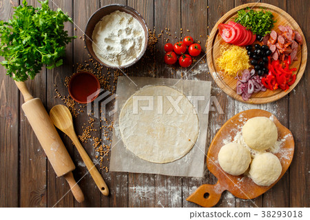 Pizza dough with ingredients on wood Pizza dough with ingredients on wood 38293018