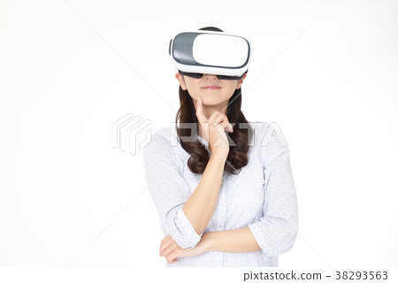 Woman wearing VR goggles Woman wearing VR goggles 38293563