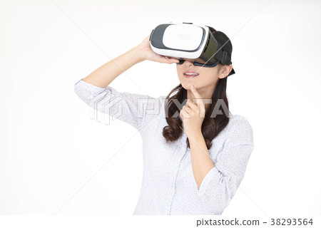 Woman wearing VR goggles Woman wearing VR goggles 38293564