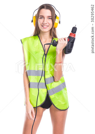 attractive young brunette woman in builder vest attractive young brunette woman in builder vest 38295462