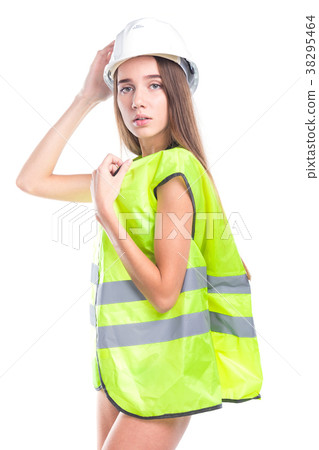 attractive young brunette woman in green builder attractive young brunette woman in green builder 38295464