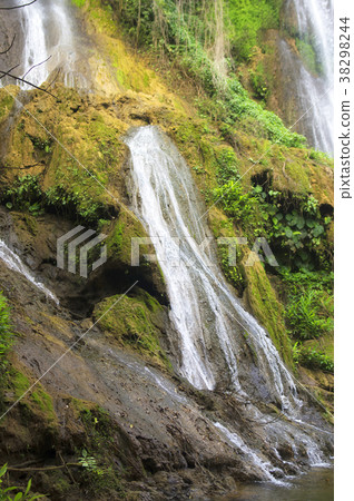 Waterfall water jets fall from a height between 38298244