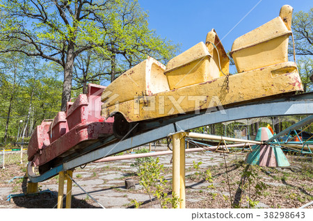 Old rusty carousel in a summer public park 38298643
