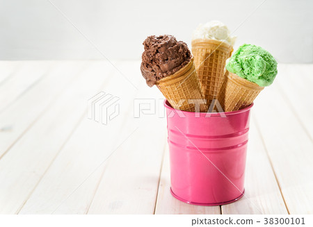 Three sorts of ice cream in waffel cones Three sorts of ice cream in waffel cones 38300101