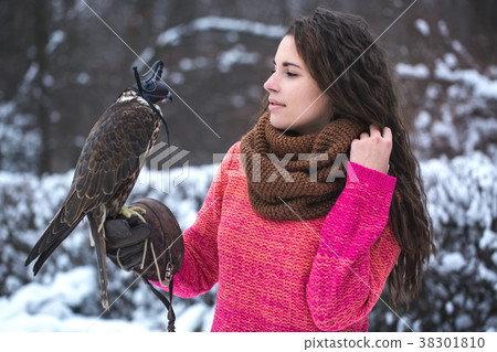 A woman communicates with a bird A woman communicates with a bird 38301810