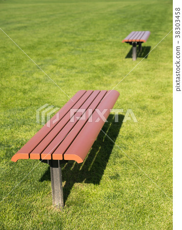Side View of The Brown Long Chair on The Lawn 38303458