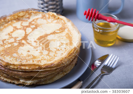 Traditional Russian pancakes with honey. Traditional Russian pancakes with honey. 38303607