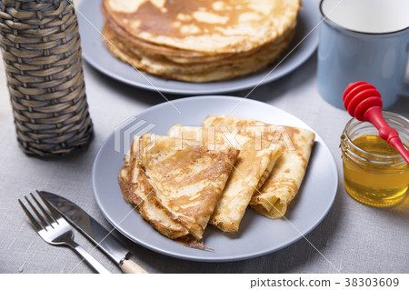 Traditional Russian pancakes with honey. Traditional Russian pancakes with honey. 38303609